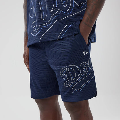 LA Dodgers MLB Mix League Blue Oversized Mesh Shorts, front side view showing the embroidered New Era logo on the left leg, with oversized white outlined 'Dodgers' script across the navy blue mesh fabric.