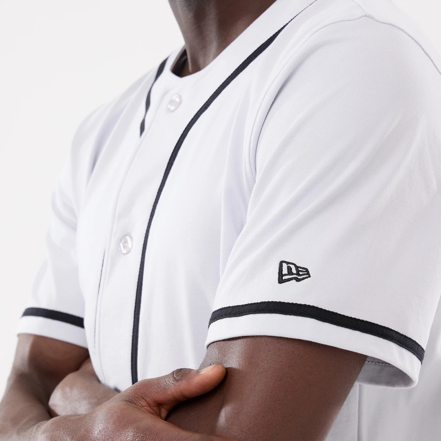 The model is wearing this New Era Basic Jersey in white. 4