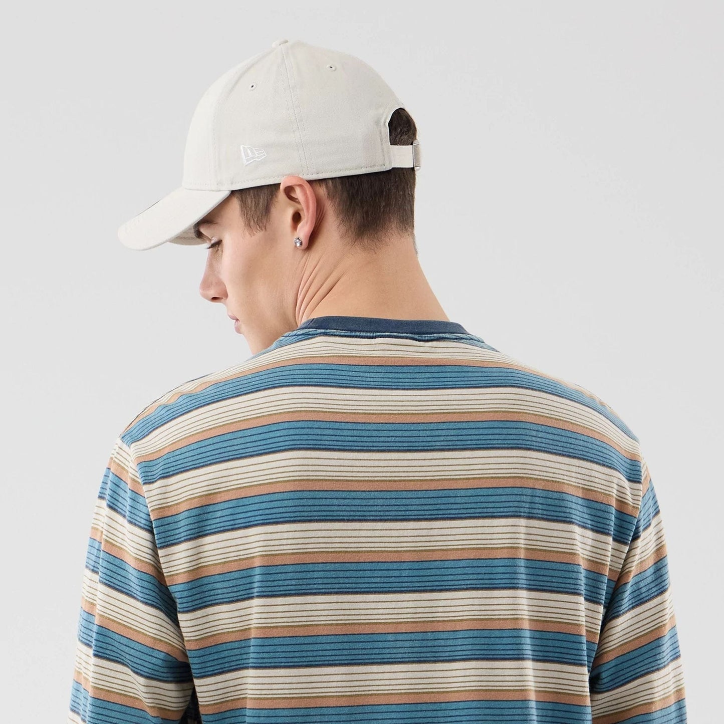 The model is wearing this Thisisneverthat X New Era Border Long Sleeve T-Shirt in beige. 7