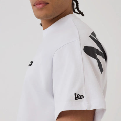 The model is wearing this New Era Distressed T-Shirt in white. 6