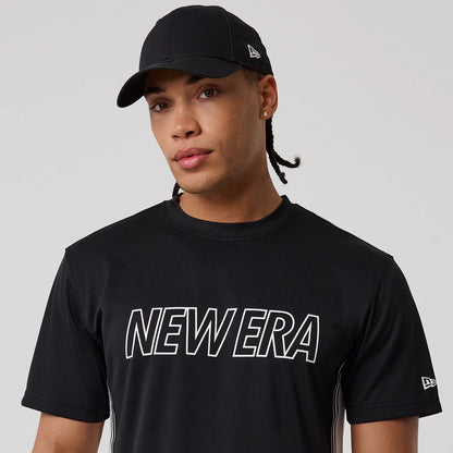 The model is wearing this New Era Mesh T-Shirt in black. 6
