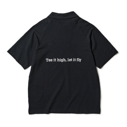 The model is wearing this New Era Seersucker Polo T-Shirt in black. 2