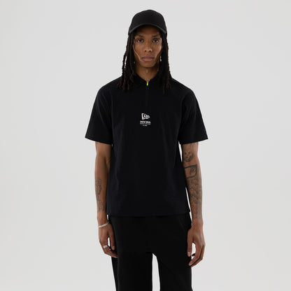 The model is wearing this New Era Seersucker Polo T-Shirt in black. 1
