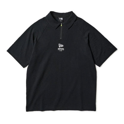The model is wearing this New Era Seersucker Polo T-Shirt in black. 7