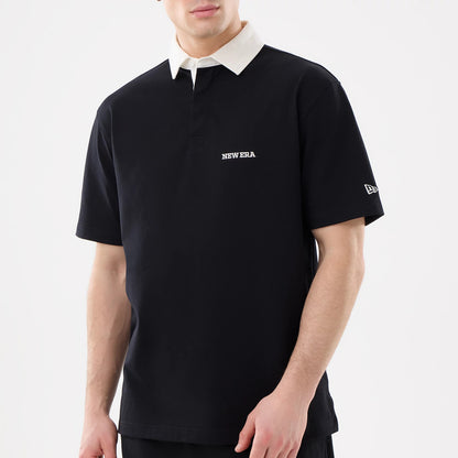 The model is wearing this New Era Short Sleeve Rugby Shirt in black. 3