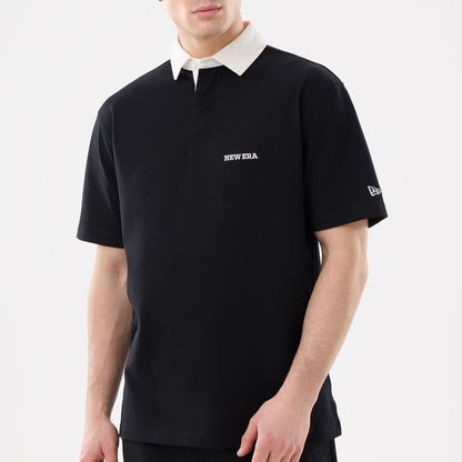 The model is wearing this New Era Short Sleeve Rugby Shirt in black. 3