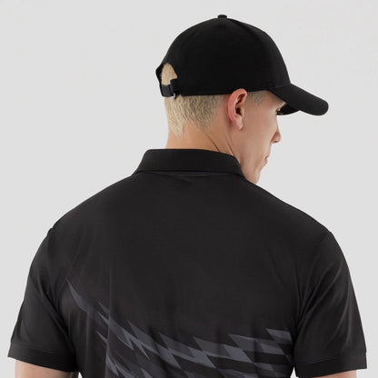 The model is wearing this New Era Grid Polo T-Shirt in black. 6