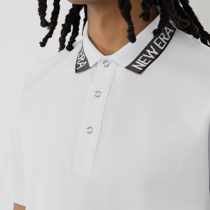 The model is wearing this New Era Kanoko Polo T-Shirt in white. 3