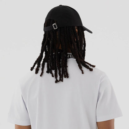 The model is wearing this New Era Kanoko Polo T-Shirt in white. 7