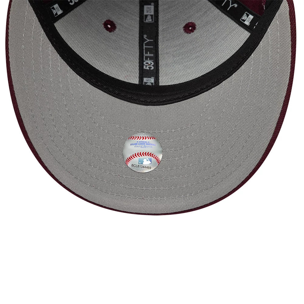Pictured is this MLB College Varsity St. Louis Cardinals Low Profile 59FIFTY Fitted cap in dark red. 2