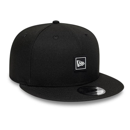 Pictured is this New Era Flag Patch 9FIFTY Snapback cap in black. 3