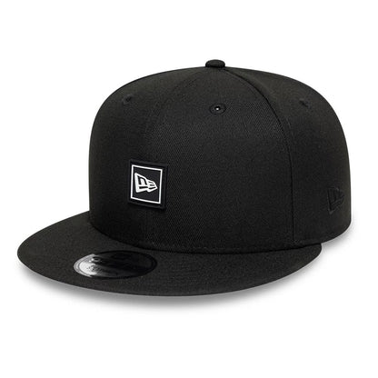 Pictured is this New Era Flag Patch 9FIFTY Snapback cap in black. 1
