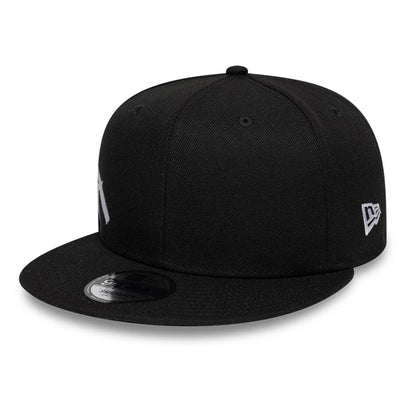 Pictured is this New Era Essential Tagging 9FIFTY Snapback cap in black. 1