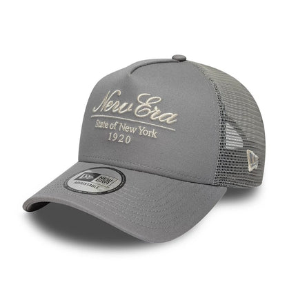 Pictured is this New Era Script 9FORTY A-Frame Trucker cap in grey. 1