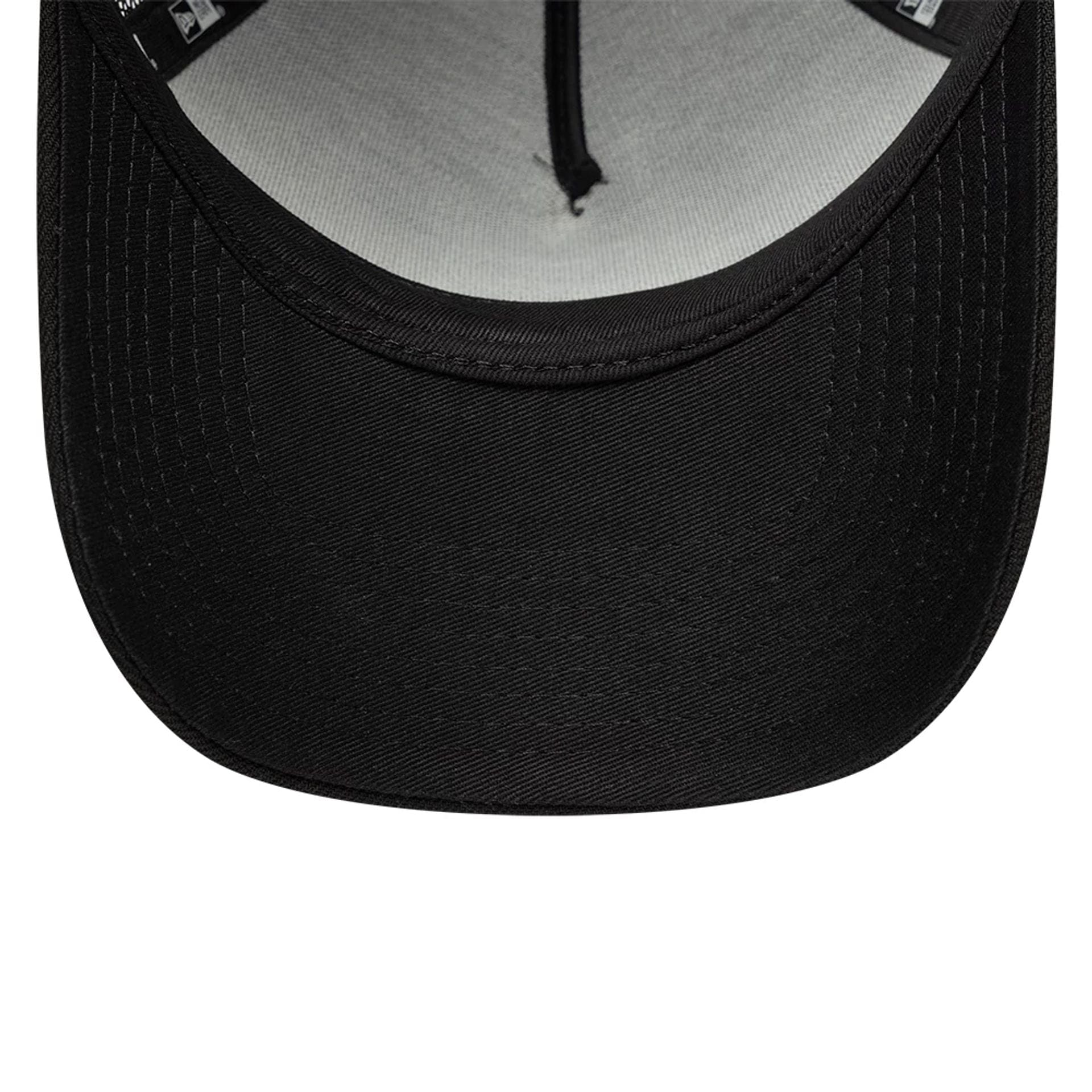 Pictured is this New Era Wall Art Grafitti 9FORTY A-Frame Trucker cap in black. 7