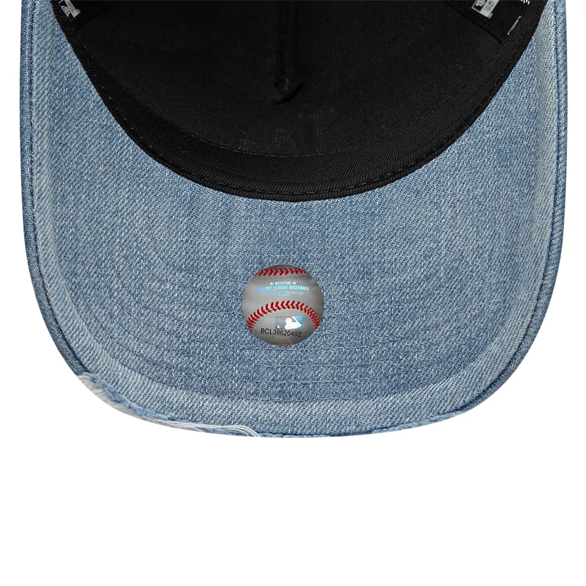 Pictured is this MLB Distressed Washed Denim LA Dodgers 9FORTY A-Frame Trucker cap in blue. 7
