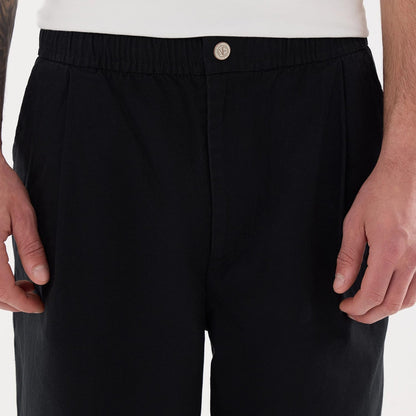The model is wearing this New Era Balloon Leg Trousers in black. 3