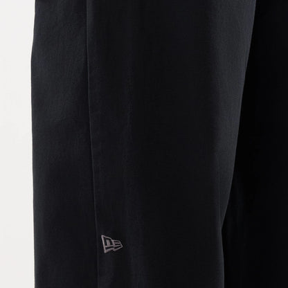 The model is wearing this New Era Balloon Leg Trousers in black. 4