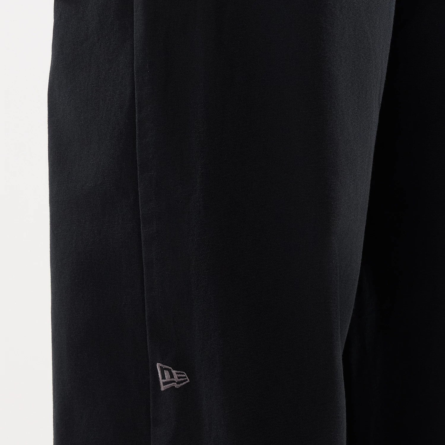 The model is wearing this New Era Balloon Leg Trousers in black. 4