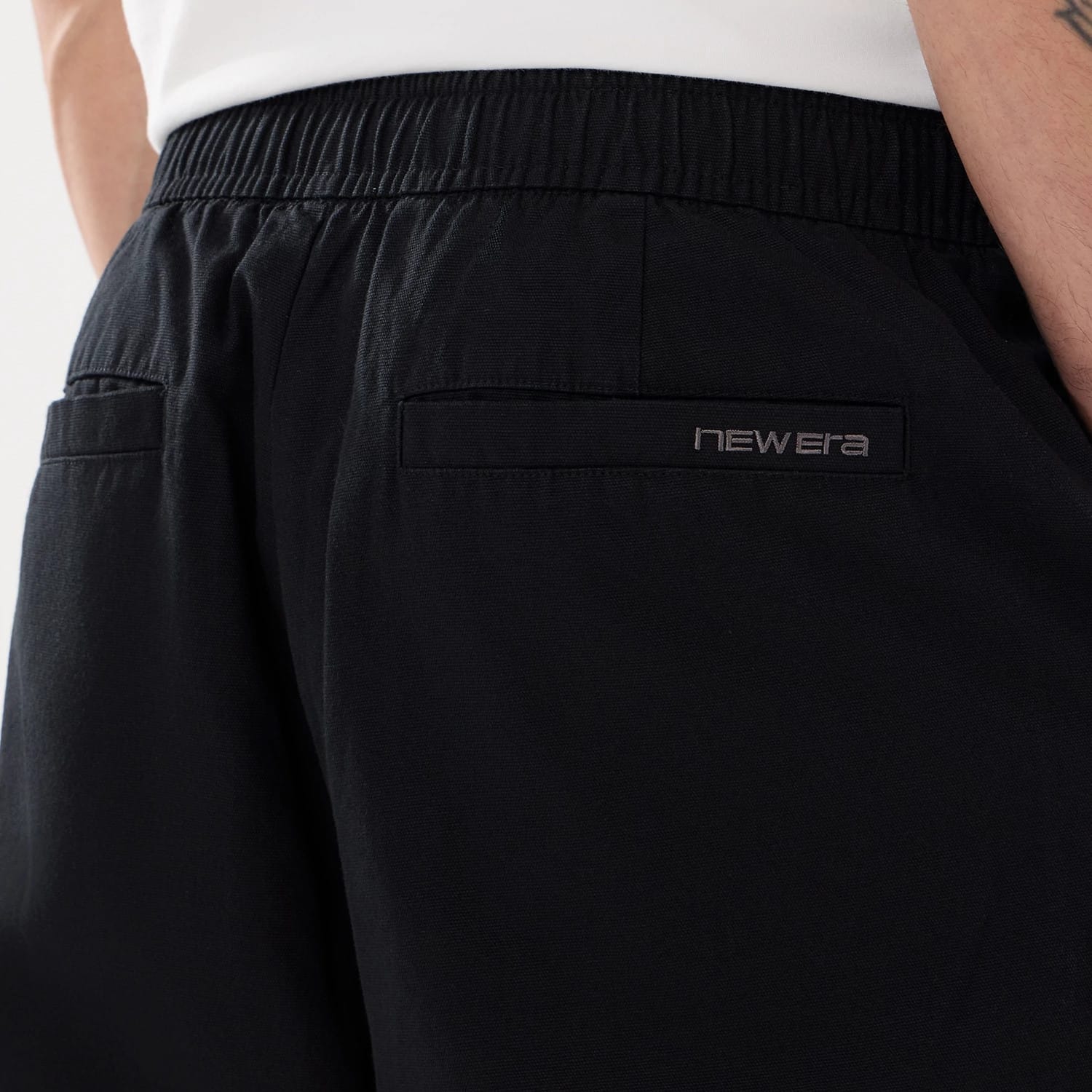 The model is wearing this New Era Balloon Leg Trousers in black. 6