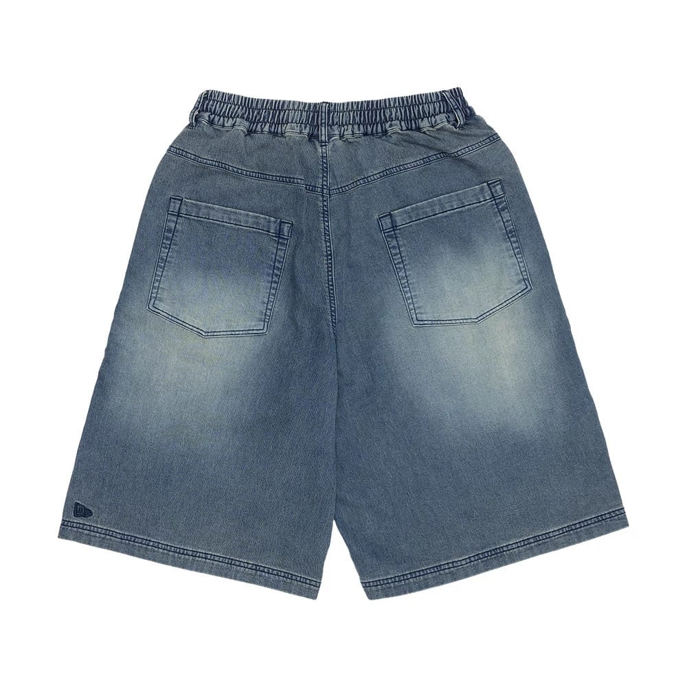 The model is wearing this New Era Washed Bermuda Shorts in blue. 6
