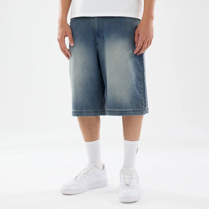 The model is wearing this New Era Washed Bermuda Shorts in blue. 1