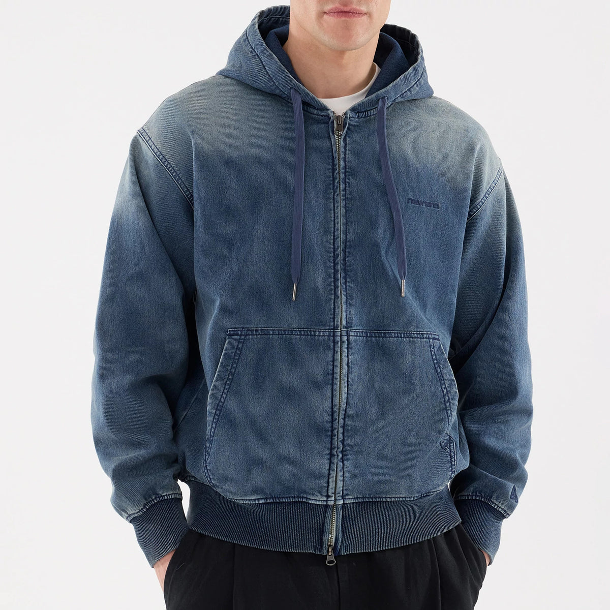 New Era Washed Blue Full Zip Hoodie, front view showing the washed blue fabric, full-length zip, drawstring hood, double front pockets, and an embossed New Era logo on the left chest.