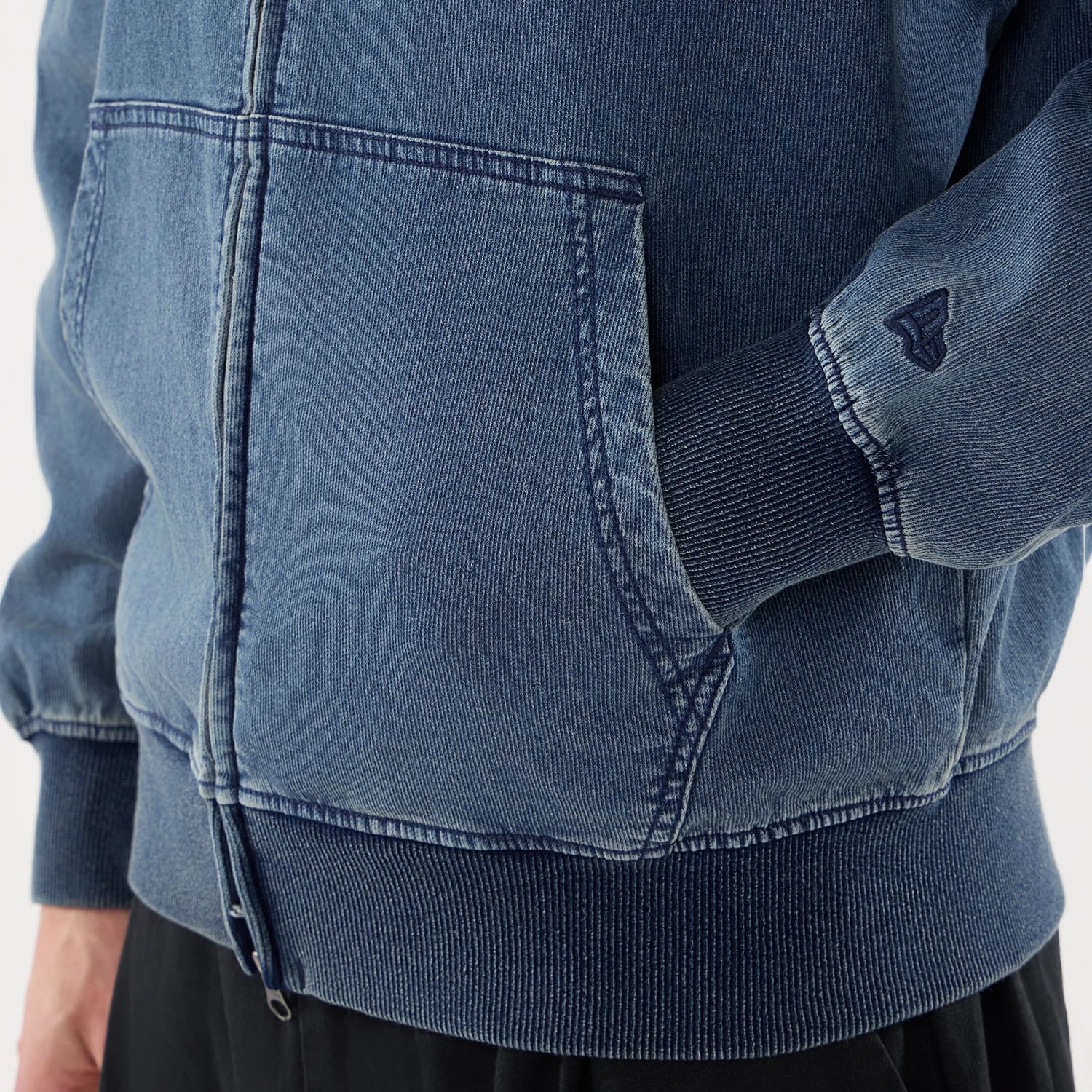 The model is wearing this New Era Washed Full Zip Hoodie in blue. 5