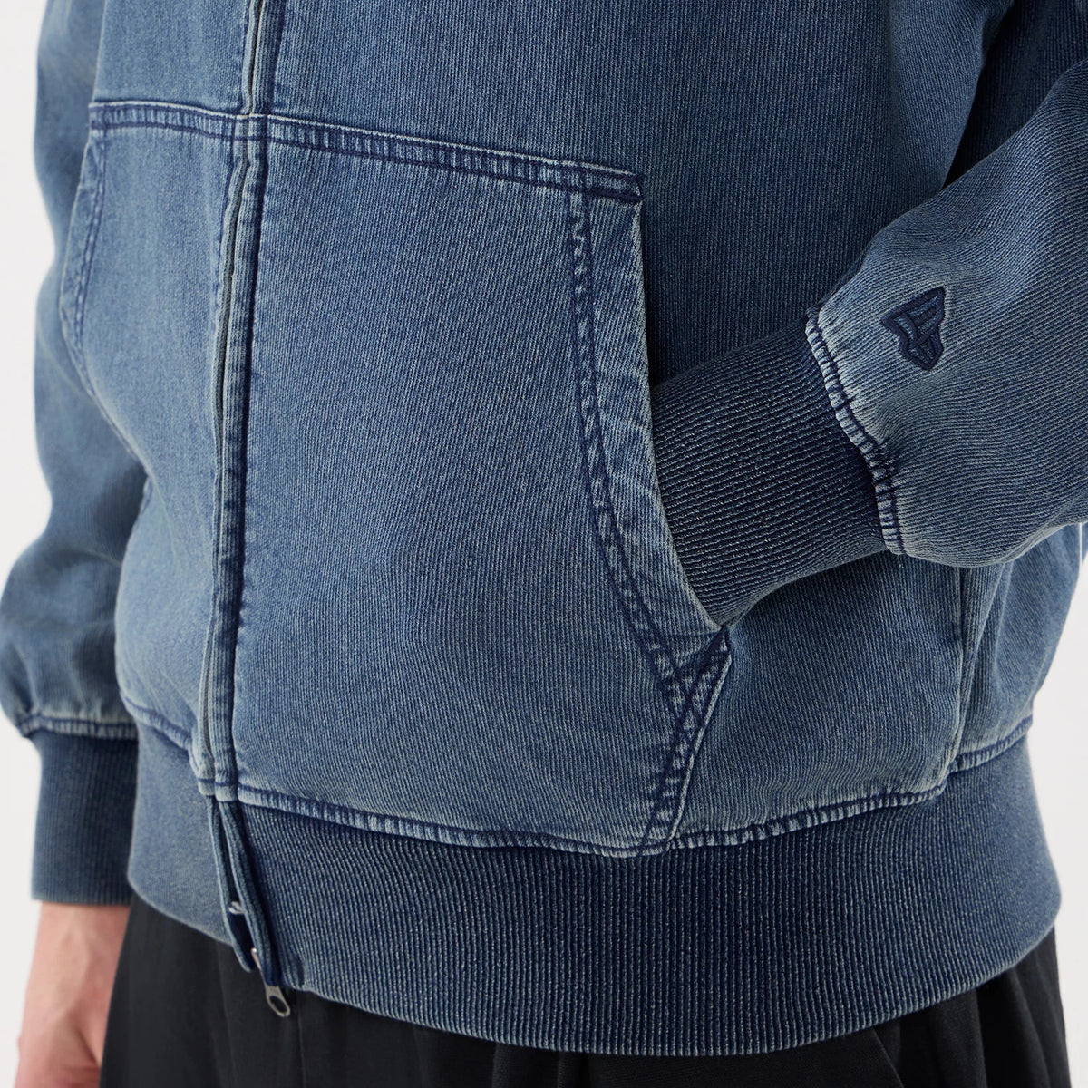 The model is wearing this New Era Washed Full Zip Hoodie in blue. 5