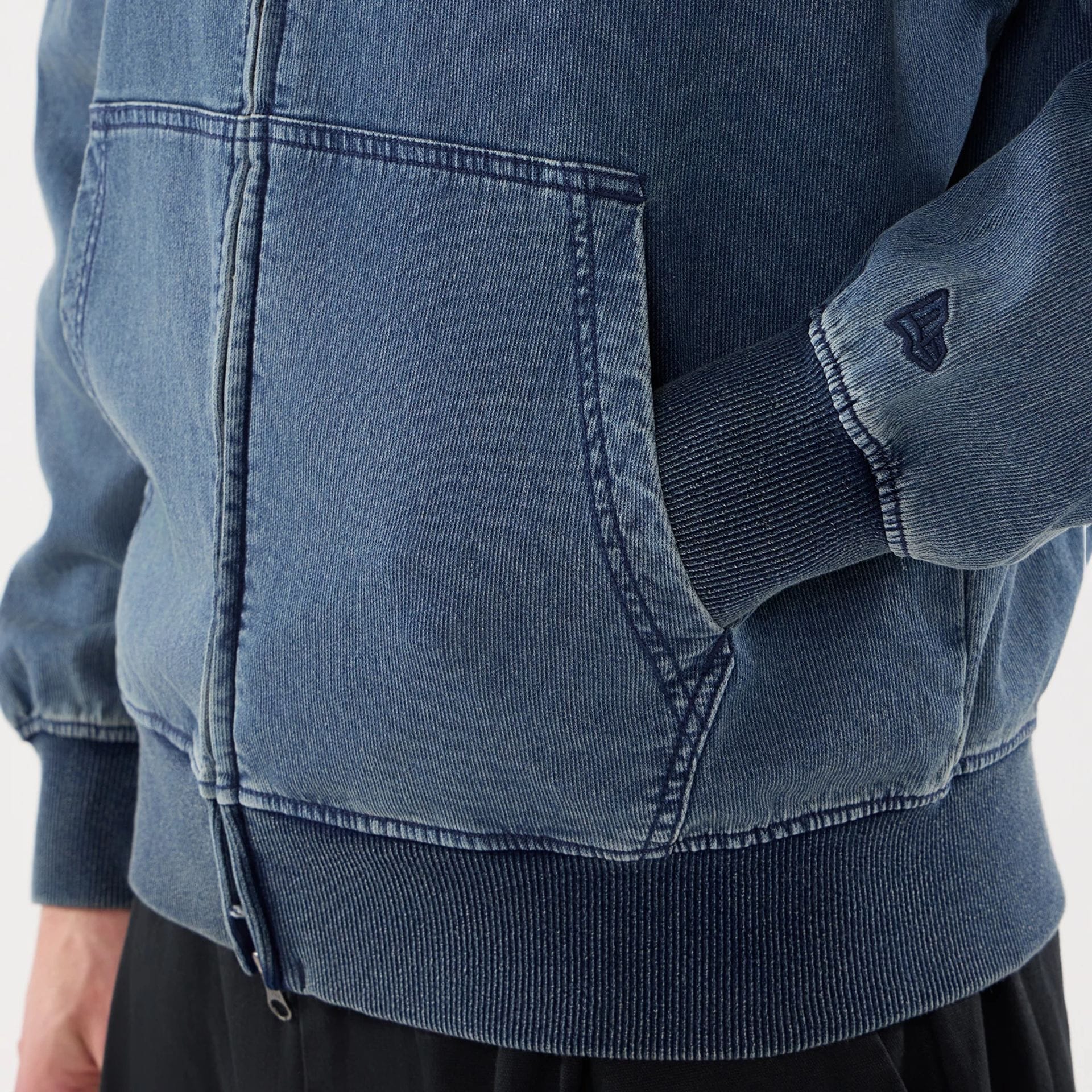 The model is wearing this New Era Washed Full Zip Hoodie in blue. 5