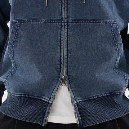 New Era Washed Blue Full Zip Hoodie, front view showing the distressed blue fabric with a silver full-length zip, two large front pockets, and ribbed cuffs and hem over a white shirt.
