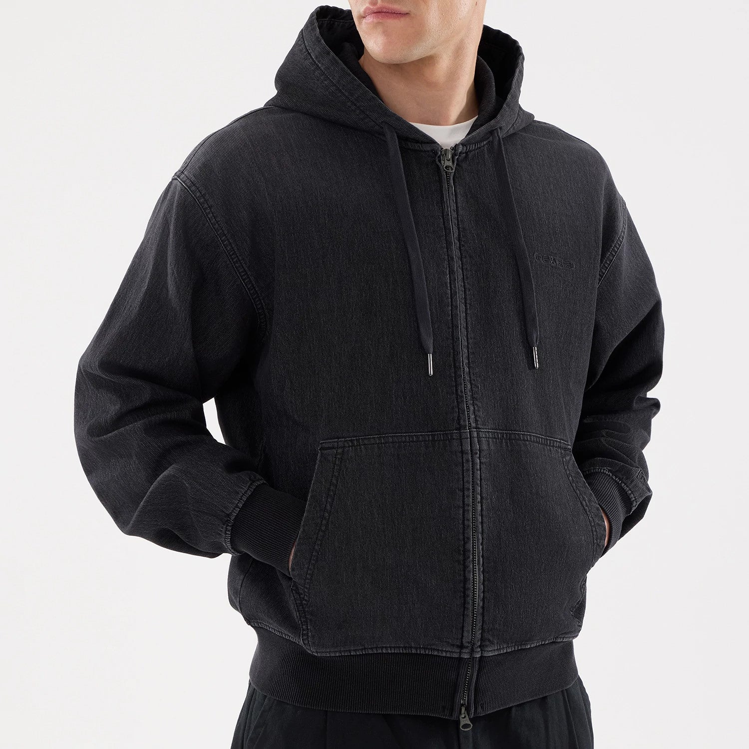 The model is wearing this New Era Washed Full Zip Hoodie in black. 3