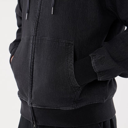 The model is wearing this New Era Washed Full Zip Hoodie in black. 5