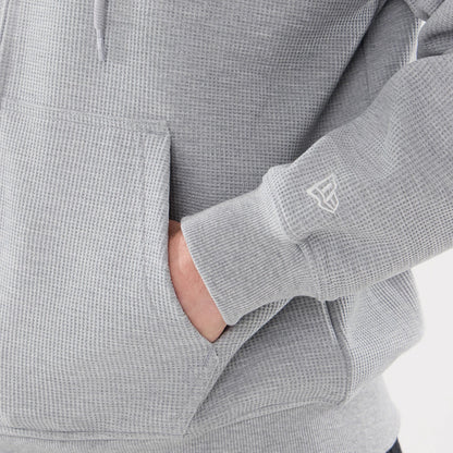 The model is wearing this New Era Waffle Full Zip Hoodie in grey. 5