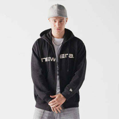 The model is wearing this New Era Waffle Full Zip Hoodie in black. 1