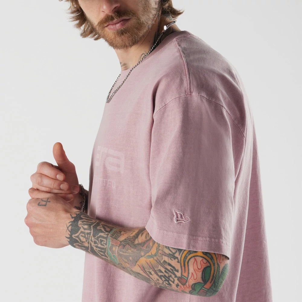 The model is wearing this New Era Originators T-Shirt in pink. 4