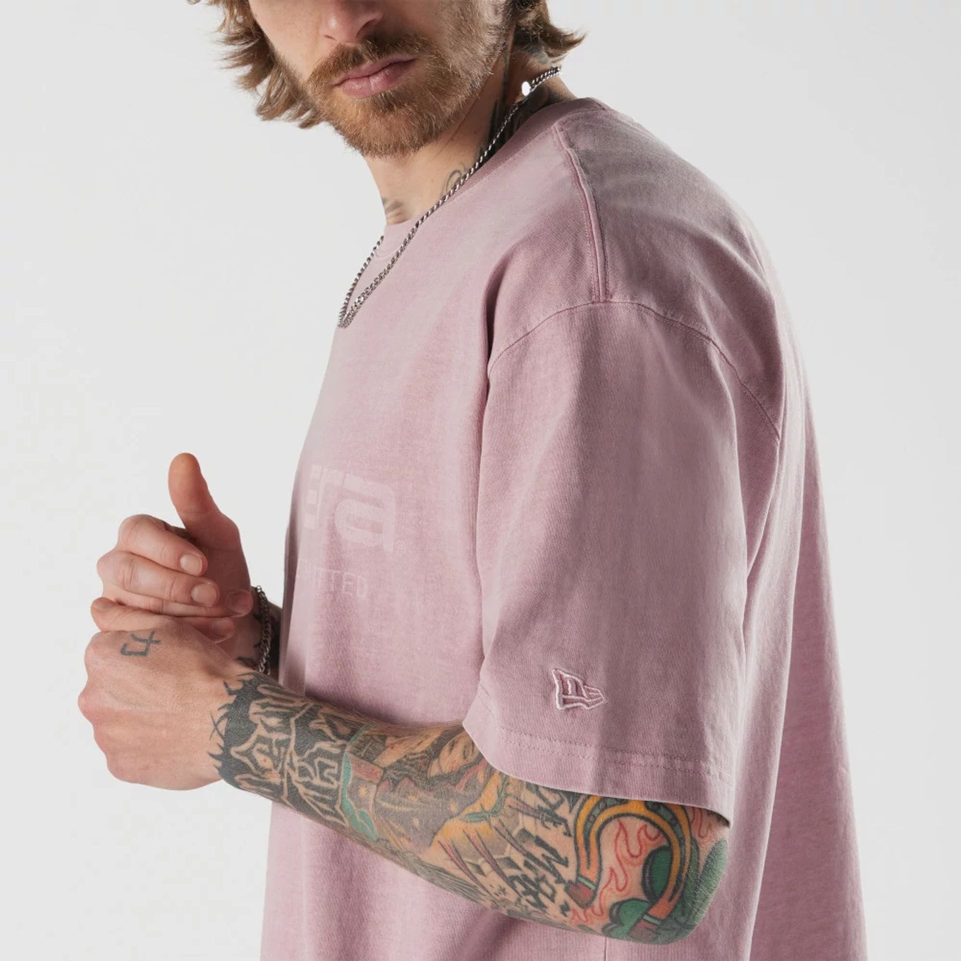 The model is wearing this New Era Originators T-Shirt in pink. 4