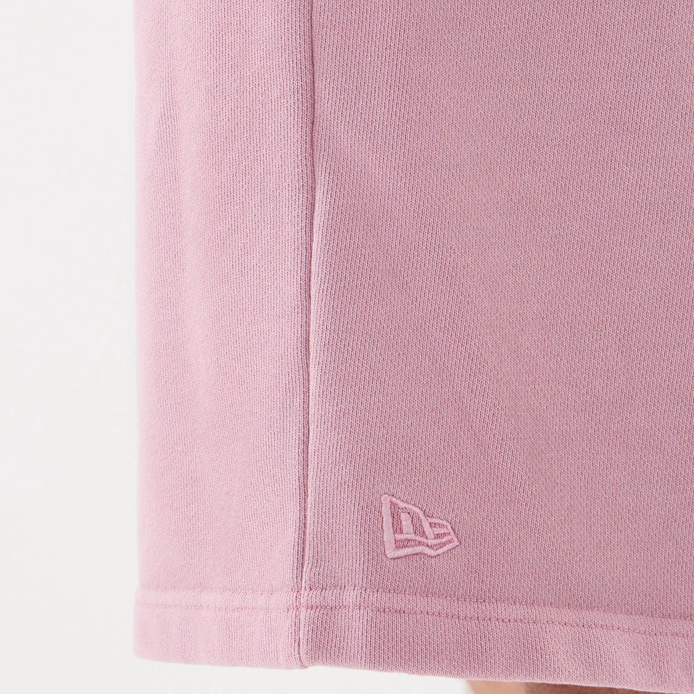 The model is wearing this New Era Originators Oversized Shorts in pink. 6