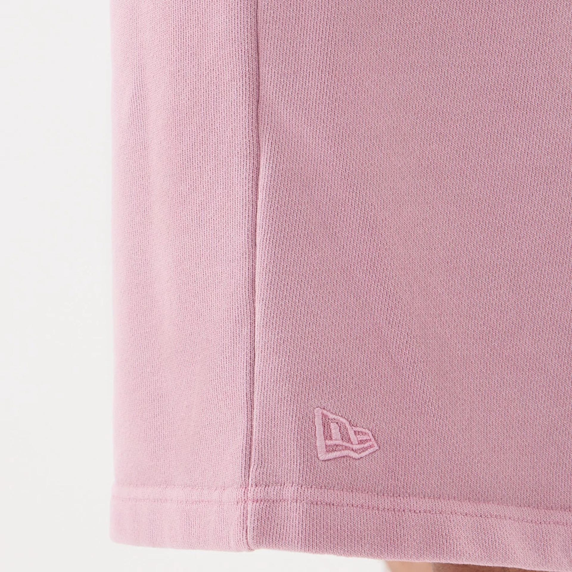 The model is wearing this New Era Originators Oversized Shorts in pink. 6