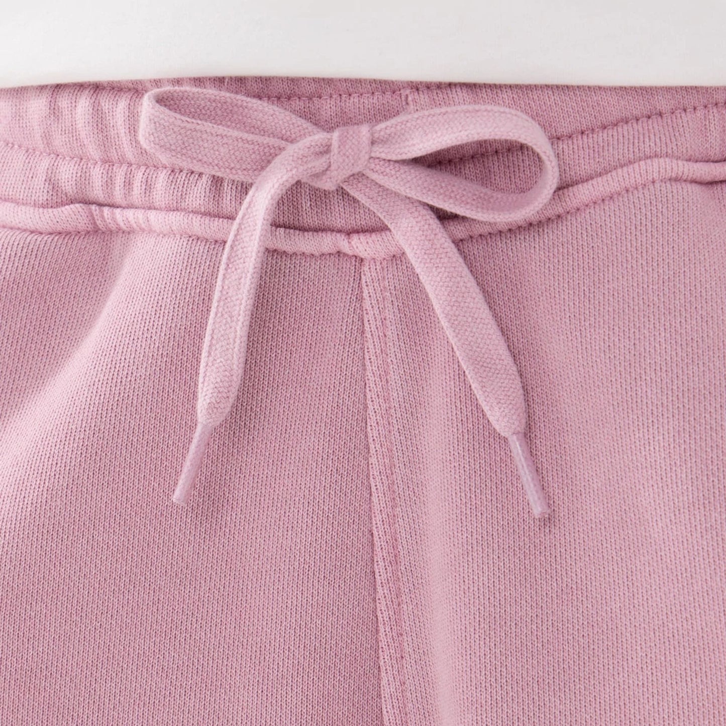The model is wearing this New Era Originators Oversized Shorts in pink. 3