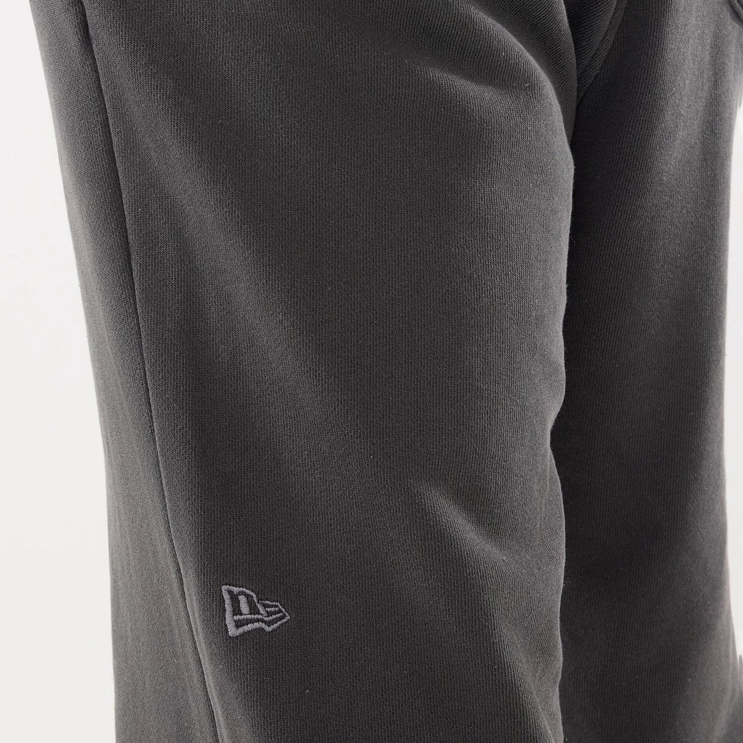 The model is wearing this New Era Originators Straight Leg Joggers in black. 4