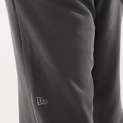 The model is wearing this New Era Originators Straight Leg Joggers in black. 4