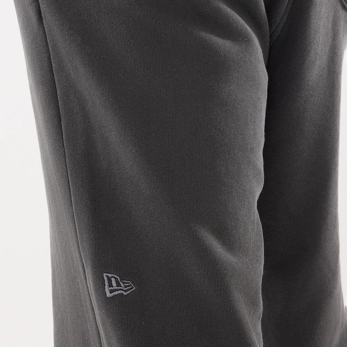 The model is wearing this New Era Originators Straight Leg Joggers in black. 4