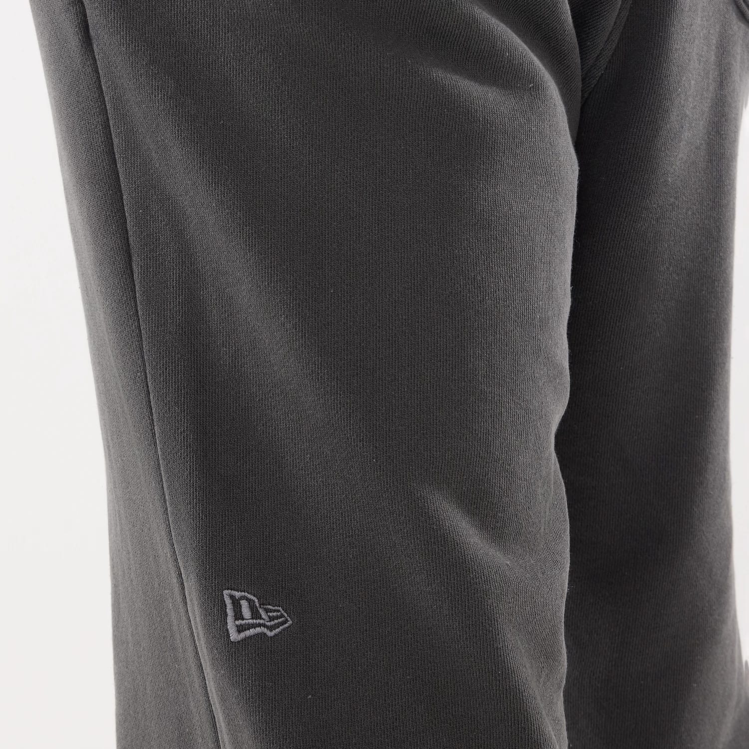 The model is wearing this New Era Originators Straight Leg Joggers in black. 4