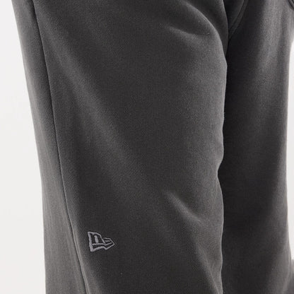 The model is wearing this New Era Originators Straight Leg Joggers in black. 4
