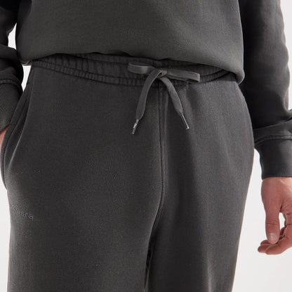The model is wearing this New Era Originators Straight Leg Joggers in black. 5