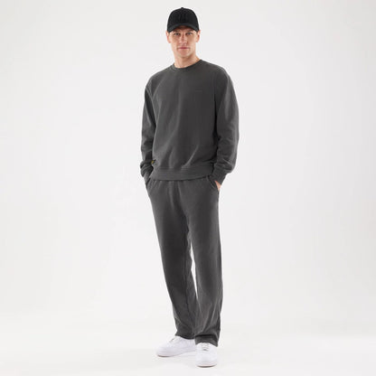 The model is wearing this New Era Originators Straight Leg Joggers in black. 8