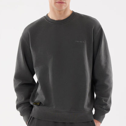 The model is wearing this New Era Originators Crew Neck Sweater in black. 6