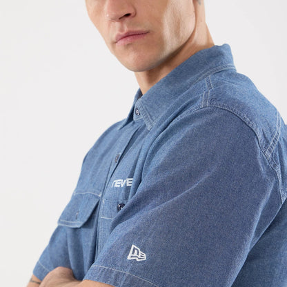 The model is wearing this New Era Originators Chambray Short Sleeve Shirt in dark blue. 5