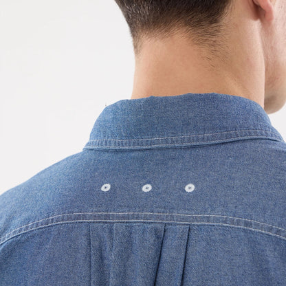 The model is wearing this New Era Originators Chambray Short Sleeve Shirt in dark blue. 7